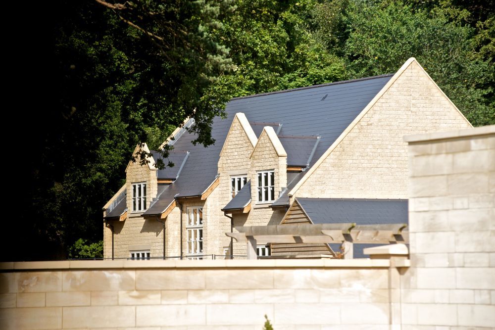 Title:This stone built executive detached residence has 4 car garaging and stands within grounds of over 1 acre including woodland. This large family 